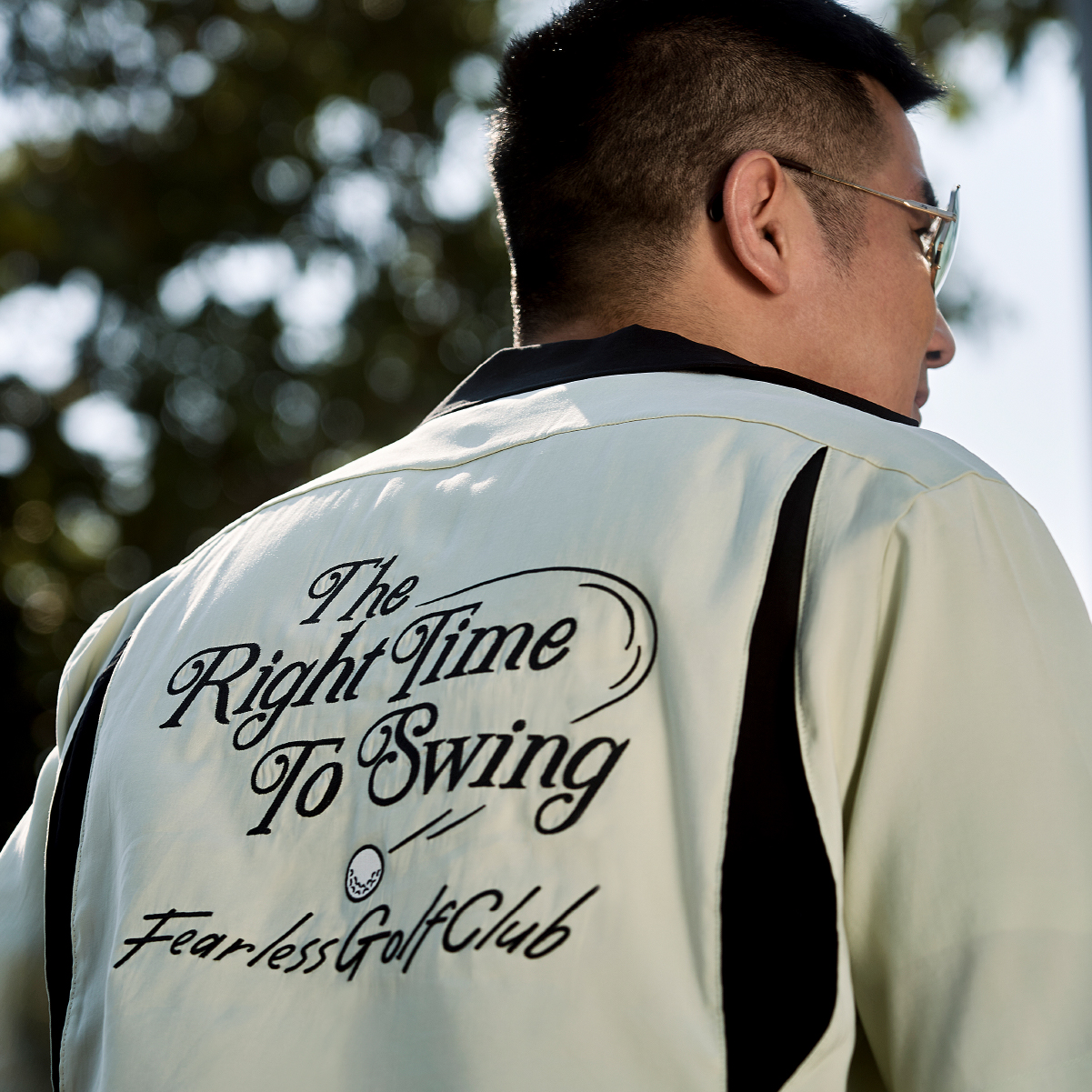 Fearlessness_man_glasses_in_bowling_shirt_look_right_side